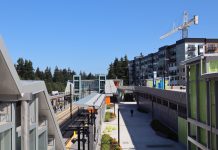 Shoreline Makes Good on Pledge to Stop Mandating Car Parking Citywide Shoreline North 185th Street station from the platform with an apartment building under construction