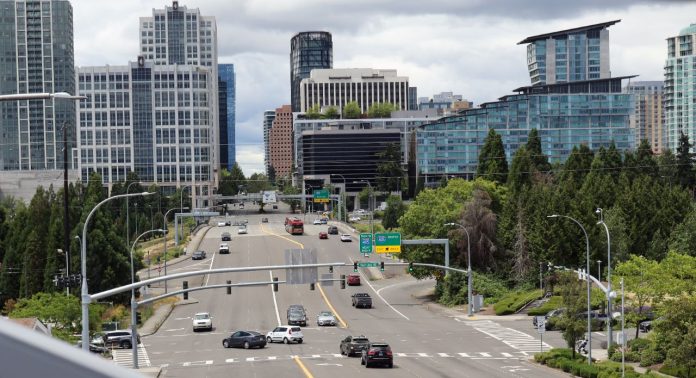 Bellevue 8th Avenue with downtown towers - Ryan Packer 1280px A high angle view of wide, car-choked 8th Avenue looking toward I-405 and the towers of Downtown Bellevue.