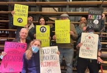 Op-Ed: Five Ways to Lower Rents in Seattle Tenants hold signs saying "hold bad landlords accountable" and "everyone deserves dignified housing" and "SROC stands against abusive landlords" and "workers rights = renters' rights"