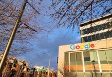 Kirkland Council Elections Could Tip City in Reactionary Direction Google's logo is illuminated in the sun at the Kirkland Urban building in Downtown Kirkland. A row of townhouses sits behind.
