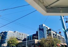 Op-Ed: Queen Anne Must Embrace New Neighbors Rather than Fear Housing Cafe Hagen is on the corner with a seven-story building in the background.