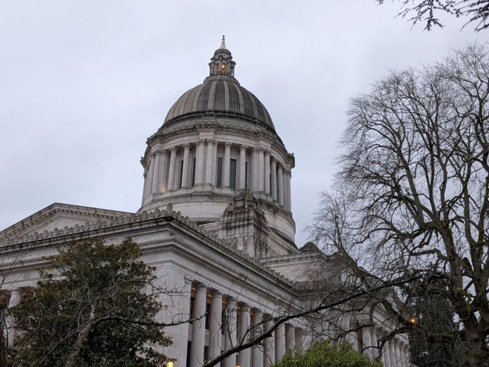 Olympia Capitol Dome by Amy Sundberg 20250109 The Olympia capital building with some trees in the foreground.