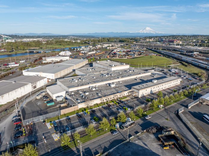 Northwest ICE Detention Center MitchPaine-2 1600px The sprawling detention center is surrounded by parking with Mount Rainier in the background.