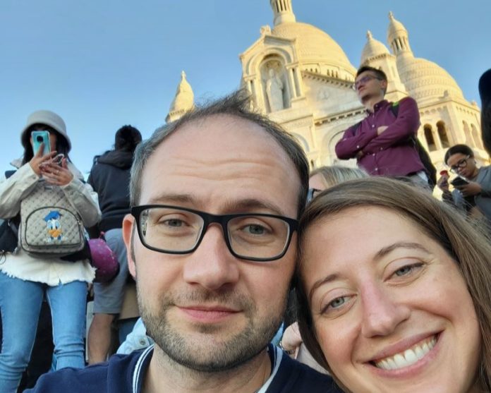 Jesse and his spouse pose in front of a basilica in Mexico City.