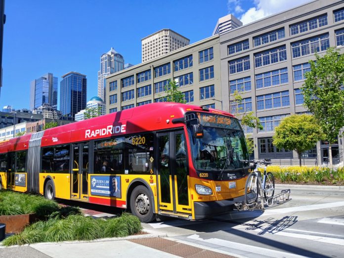 A red RapidRide bus on the Seattle waterfront