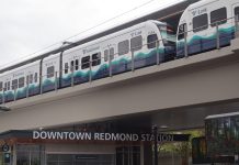 Downtown Redmond Drives 2 Line Growth, Becoming Eastside’s Busiest Rail Station A train departing Downtown Redmond Station with the station name visible below