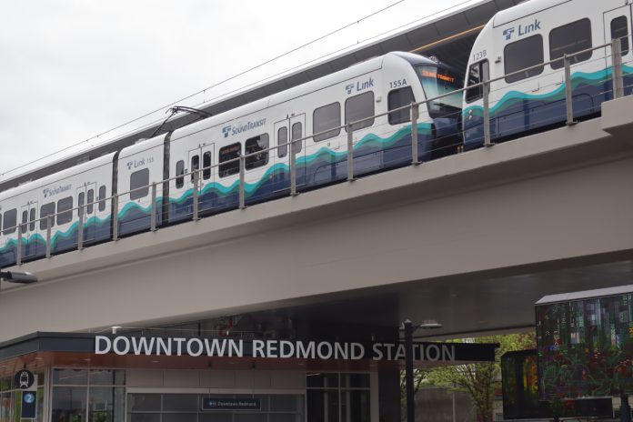 IMG_2390 A train departing Downtown Redmond Station with the station name visible below