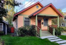 Seattle Eases Accessory Dwelling Restrictions Just Ahead of State Deadline A peach-colored house with teal trim and a grassy lawn
