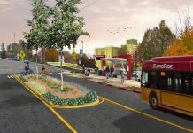 King County Council Unsnags RapidRide I Line After Property Disputes A rendering of a RapidRide bus arriving at a newly rebuilt bus stop with bus shelter and RapidRide pylon, with a median in the street adding trees and pedestrian safety. Riders wait under the shelter and two people use the cross walk, one walking a bike.