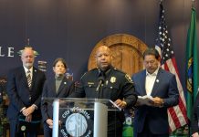 Harrell and SPOG Rush Police Contract, Hamstringing Civilian Responders, Accountability Agencies Barnes standard at the lectern with the City seal behind.