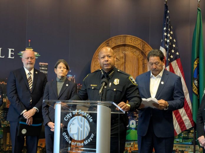 Chief Shon Barnes and Mayor Harrell SPOG Contract - Sundberg 20251022 Barnes standard at the lectern with the City seal behind.