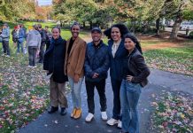 Looking Back on The Urbanist’s 2025 The five candidates stand shoulder to shoulder in Columbia Park, which is lined with trees in full autumn colors.