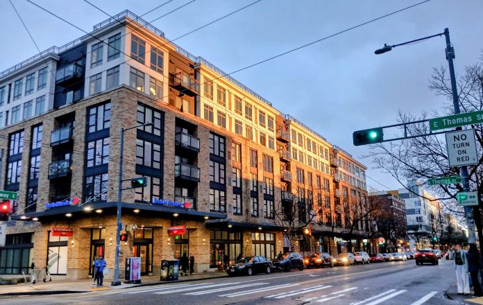 A five-over-one building on Broadway in Seattle with ground floor retail