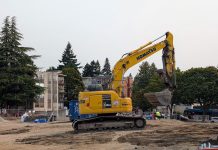 Seattle Poised to Remove SEPA Review Hurdle for Most Housing Projects A Komatsu backhoe at a large midrise construction site on Stone Way in Fremont.