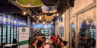 Join Us for February Urbanist Socials and Waterways Presentation March 3rd About 20 urbanists sit around a long table in the tavern.