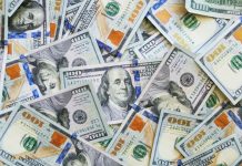 Op-Ed: Washington Legislature, Don’t Reverse the Estate Tax A big pile of $100 bills with Benjamin Franklin's face peering out.